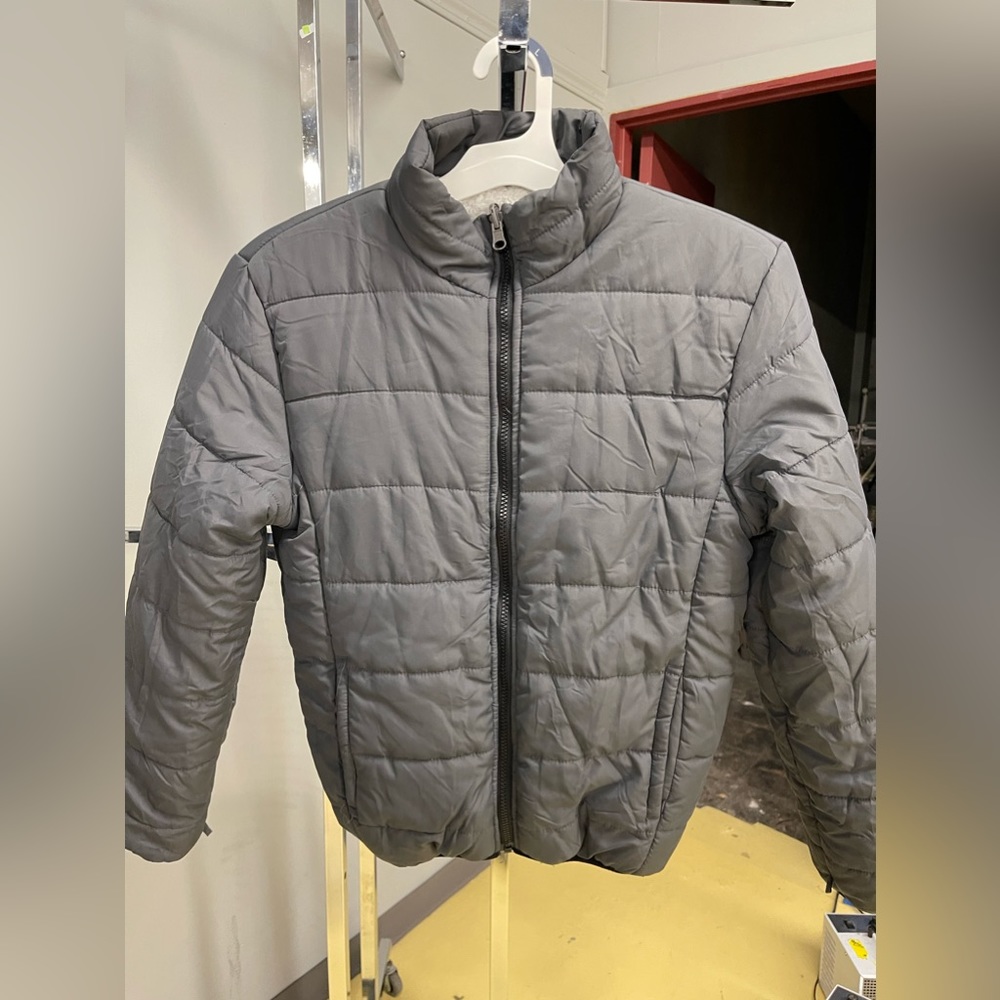 Barely worn puffer jacket with teddy fabric as lining.